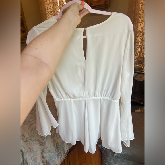 White Romper with Bell Sleeves, a Deep V Cut, and tie detailing - Picture 2 of 8